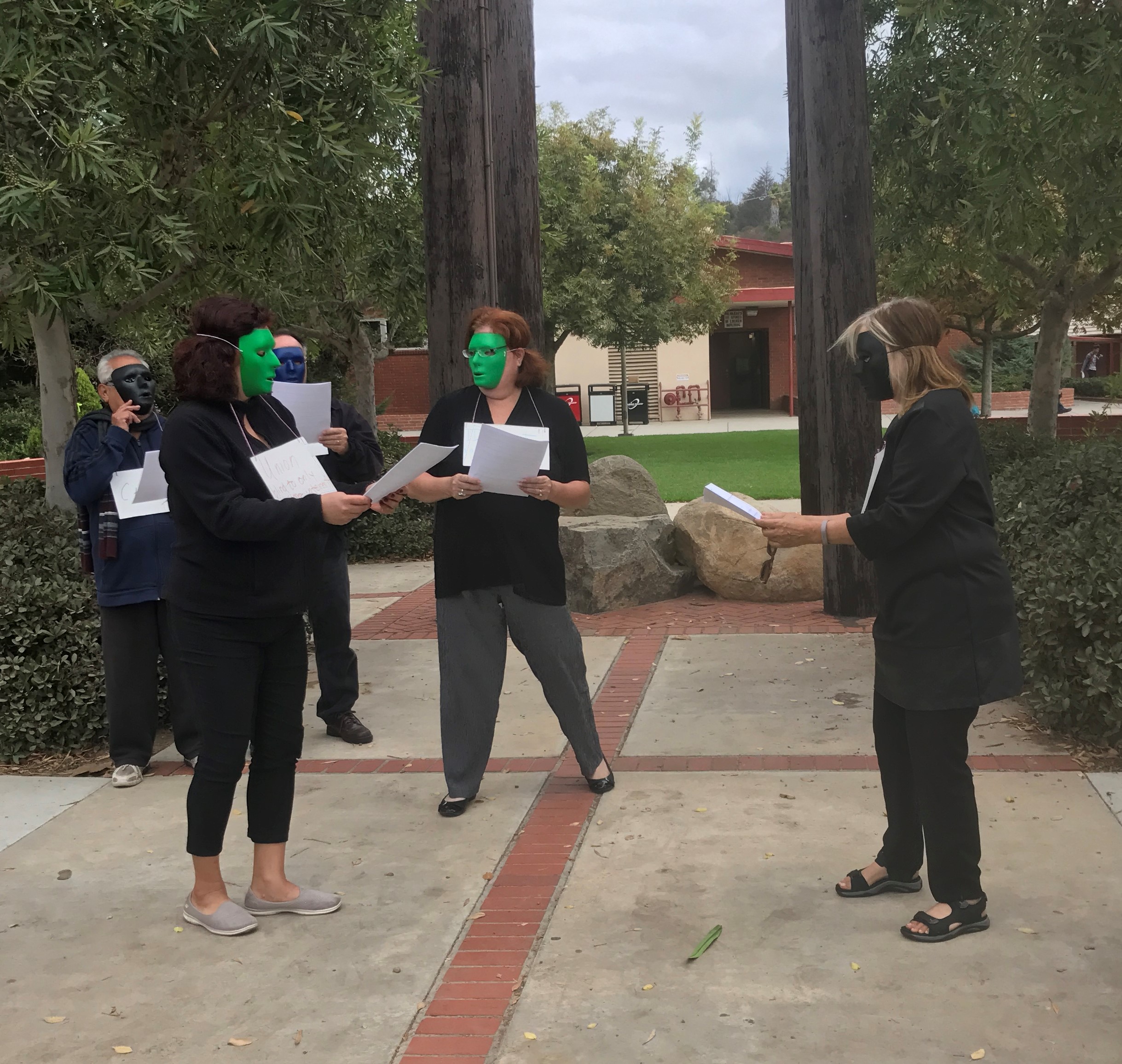 three-adjunct-faculty-wear-masks-for-equity-week-performance